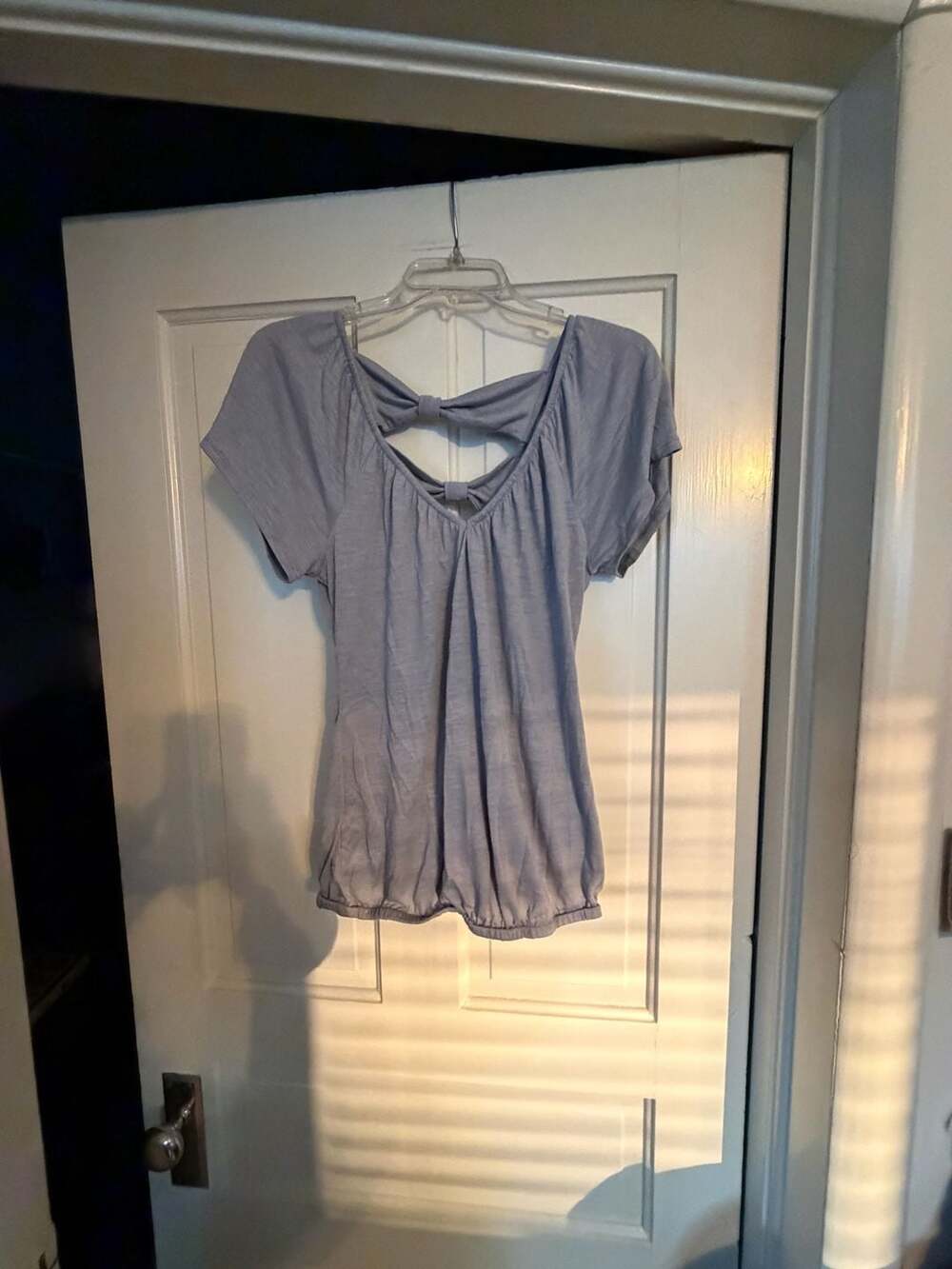 Self Esteem Women's Blue Short Sleeve Top with Back Cutout Bow Detail